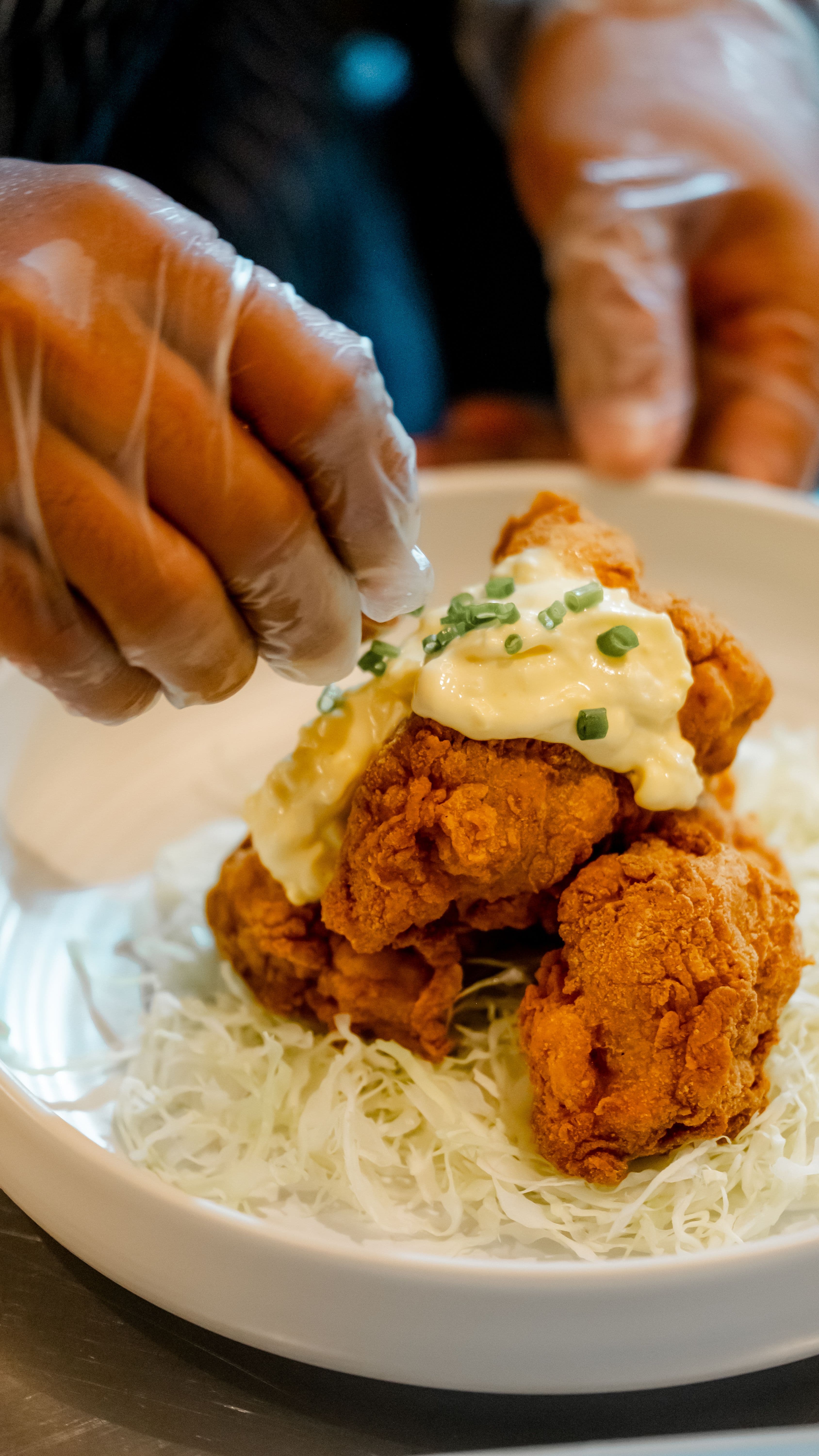 Fried chicken being finished