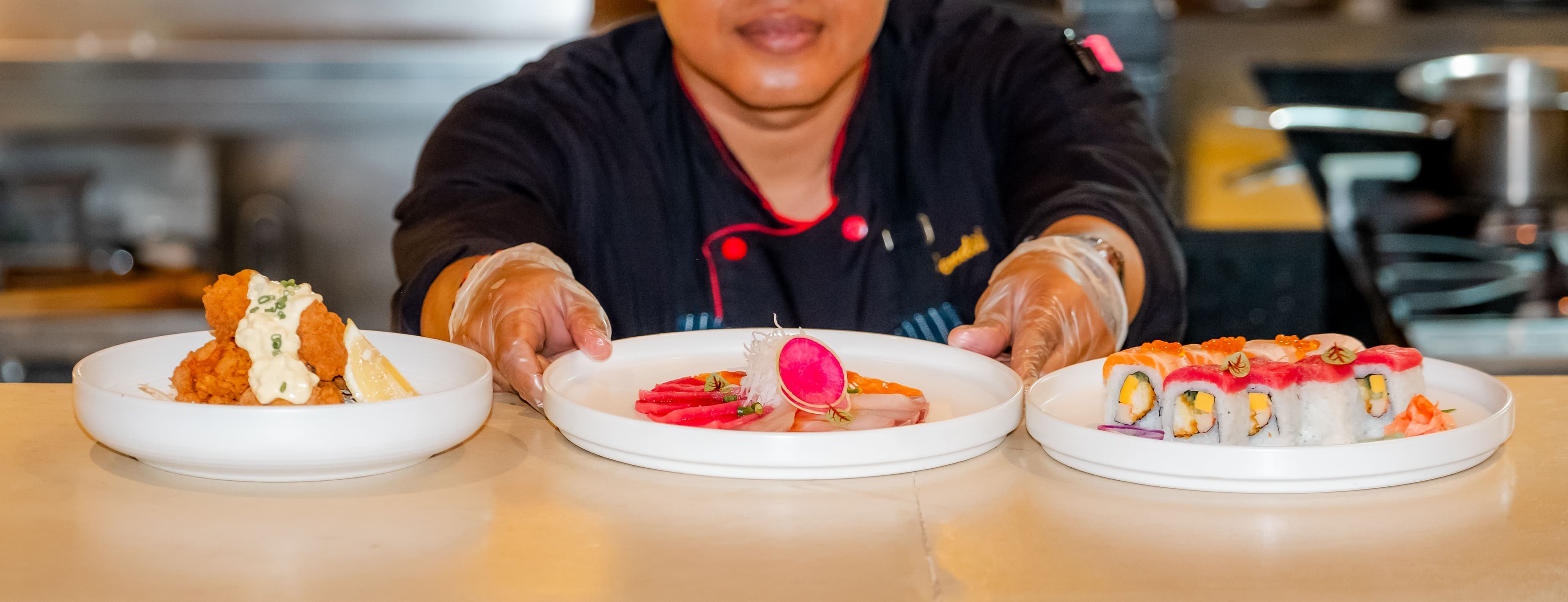 Chef presenting signature plates