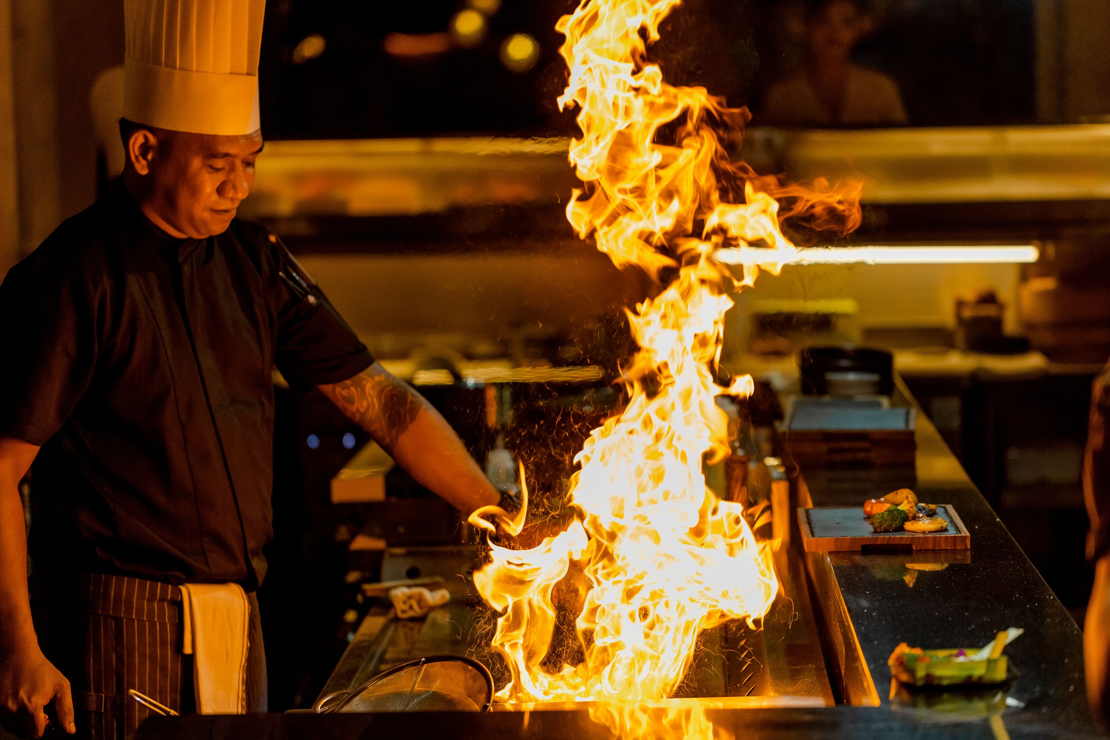 Flame cooking in the open kitchen